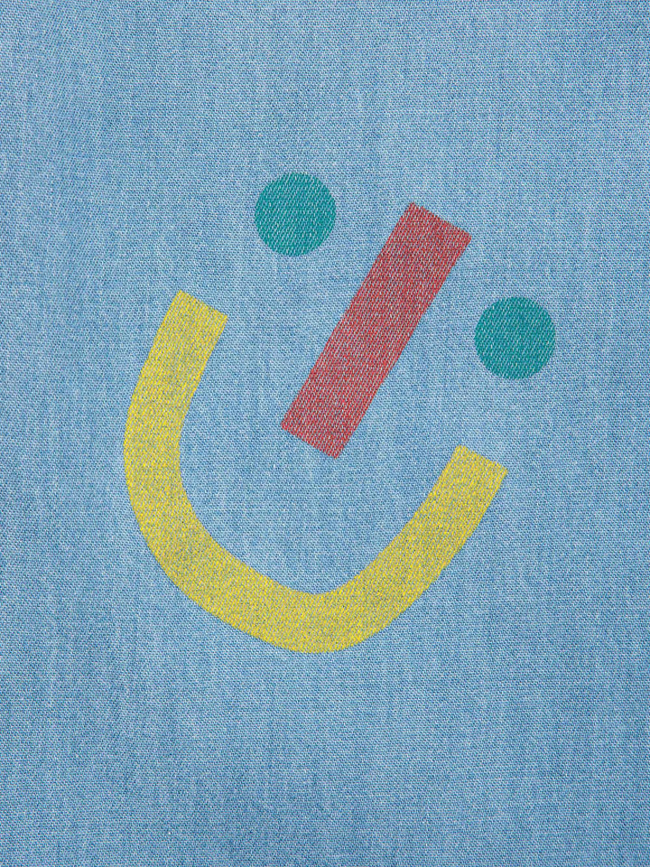 Happy face all over baggy denim pants